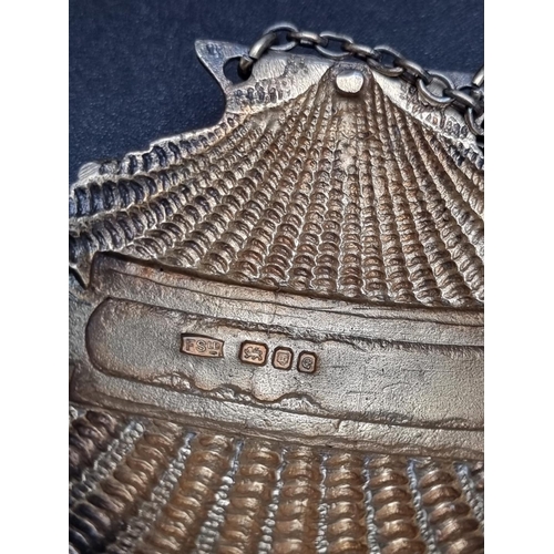 416 - A silver scallop shell 'Sherry' label, by F S Ltd, London 1960, 51mm wide, 31g.