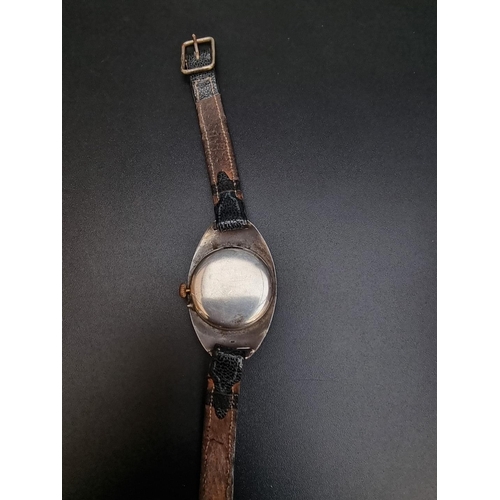 482 - A silver wristwatch, import mark London 1912, 27mm wide, on leather strap.