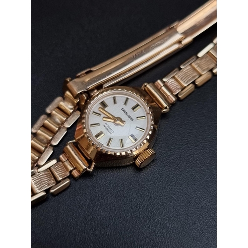 521 - An Excalibur 9ct gold manual wind ladies wristwatch, 15mm.