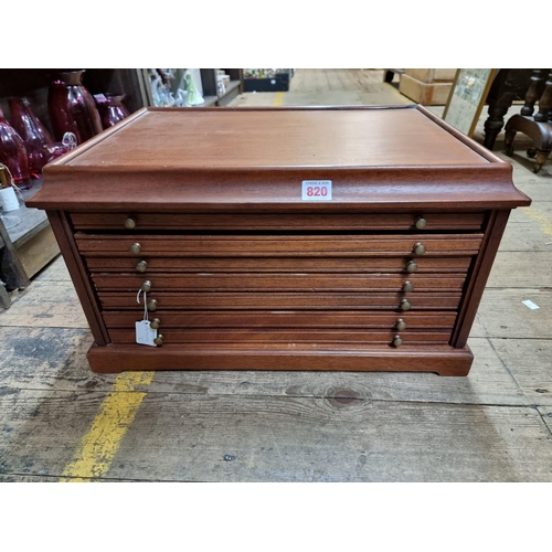 820 - A modern mahogany coin collector' chest, having seven drawers, 52cm wide. 