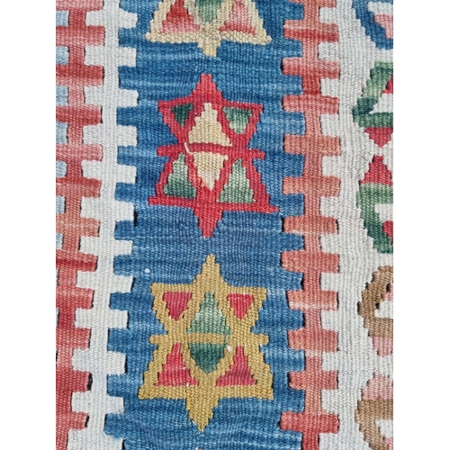1006 - A Kelim carpet, having star and geometric design, 192 x 117cm. 