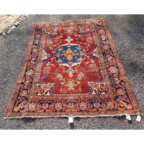 1012 - A Persian carpet, having central floral medallion, with floral cartouches to each corner, with ... 