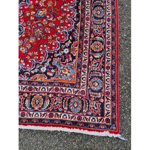 1014 - A Persian carpet, having central floral medallion, with floral borders, 295 x 199cm.... 