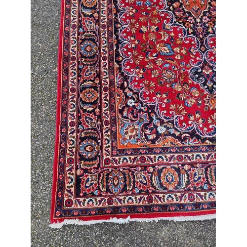 1014 - A Persian carpet, having central floral medallion, with floral borders, 295 x 199cm.... 