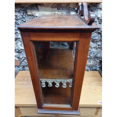 1028 - A small antique mahogany display cabinet, 51cm high x 39cm wide.