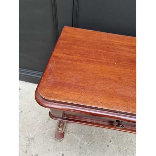 1036 - An Eastern hardwood single drawer side table, 107cm wide.