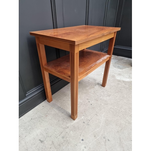 1040 - A walnut two tier occasional table, 76.5cm wide. 