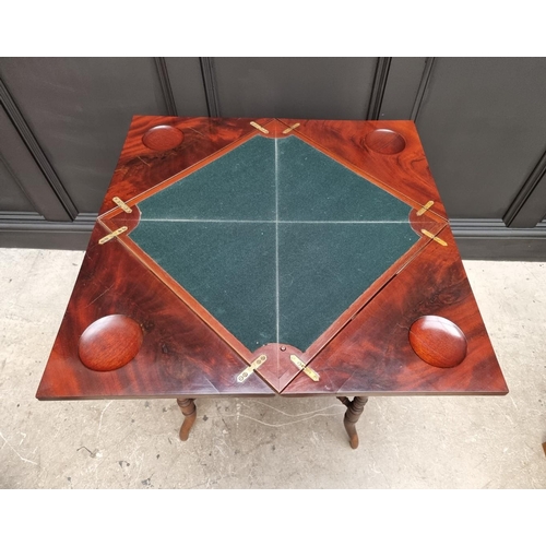 1048 - A late Victorian mahogany envelope card table, 53cm wide.