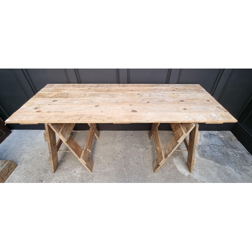 1050A - A vintage pine trestle table, 183cm wide. 