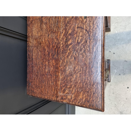1053 - A George III oak kneehole desk, 83.5cm wide. 