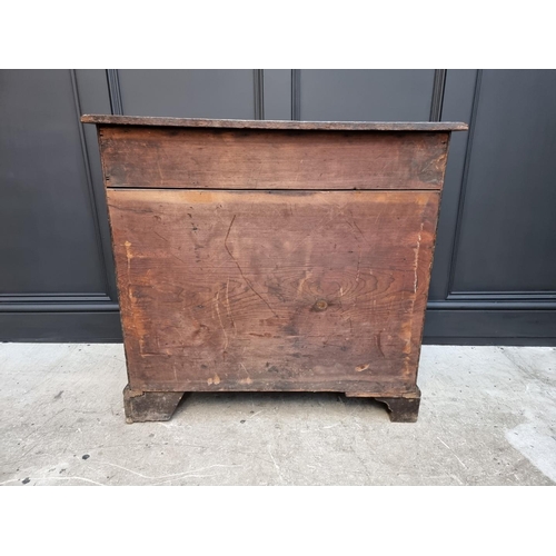 1053 - A George III oak kneehole desk, 83.5cm wide. 