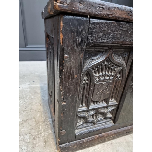1054 - A small antique carved oak panelled coffer, possibly 16th century, with linenfold decoration to top ... 