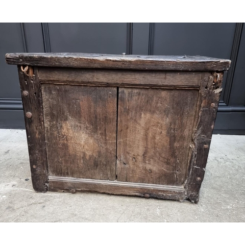 1054 - A small antique carved oak panelled coffer, possibly 16th century, with linenfold decoration to top ... 