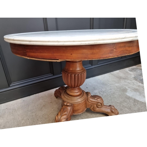 1057 - A Victorian carved mahogany and marble top circular centre table, 81cm diameter. ... 