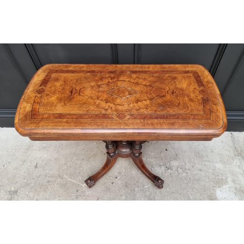 1061 - A Victorian walnut and inlaid card table, with swivel top, 92.5cm wide. 