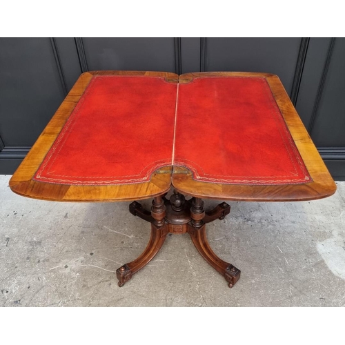 1061 - A Victorian walnut and inlaid card table, with swivel top, 92.5cm wide. 