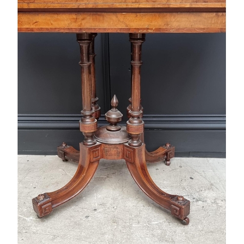 1061 - A Victorian walnut and inlaid card table, with swivel top, 92.5cm wide. 