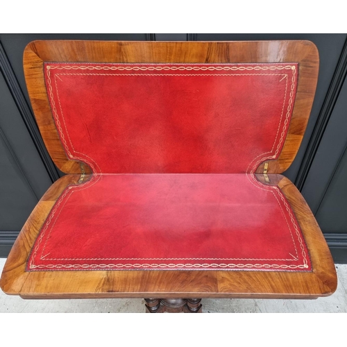 1061 - A Victorian walnut and inlaid card table, with swivel top, 92.5cm wide. 