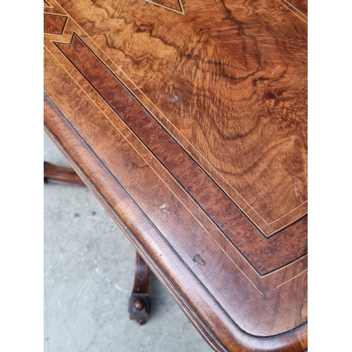 1061 - A Victorian walnut and inlaid card table, with swivel top, 92.5cm wide. 