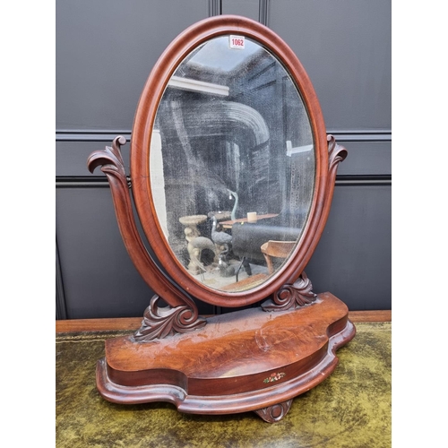 1062 - A Victorian mahogany toilet mirror, 66cm wide. 