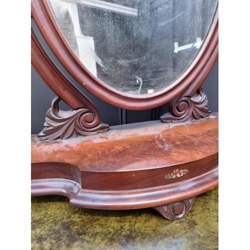 1062 - A Victorian mahogany toilet mirror, 66cm wide. 