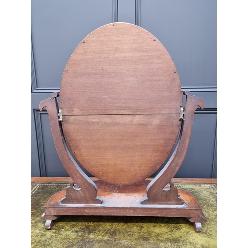 1062 - A Victorian mahogany toilet mirror, 66cm wide. 