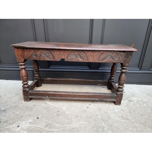 1064 - An antique oak long joint stool, 91.5cm long.