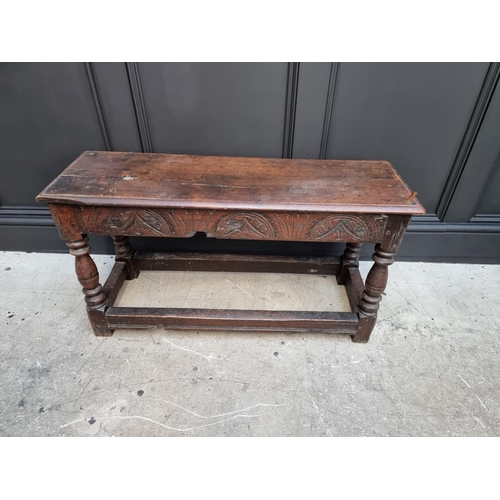 1064 - An antique oak long joint stool, 91.5cm long.