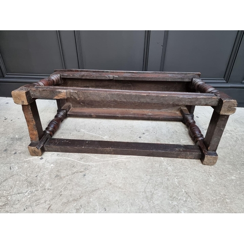 1064 - An antique oak long joint stool, 91.5cm long.