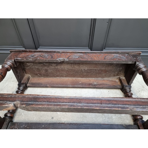 1064 - An antique oak long joint stool, 91.5cm long.