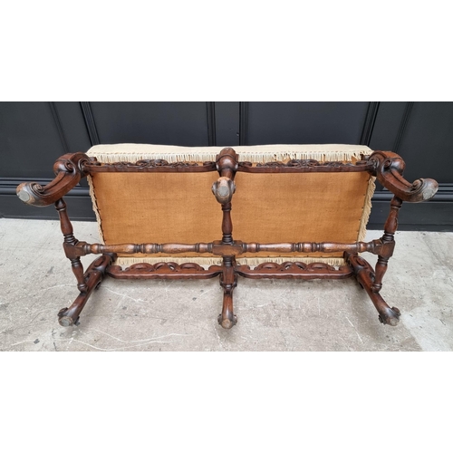 1067 - A William and Mary style carved walnut and upholstered long stool, 104cm wide.