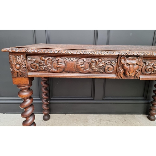 1068 - A late Victorian carved oak desk, with leather inset service above a pair of frieze drawers, 117cm w... 