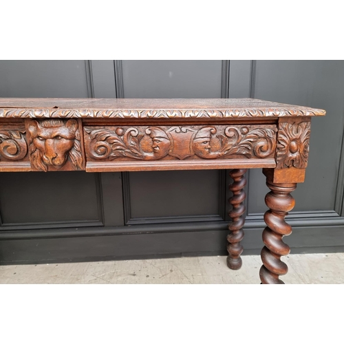 1068 - A late Victorian carved oak desk, with leather inset service above a pair of frieze drawers, 117cm w... 