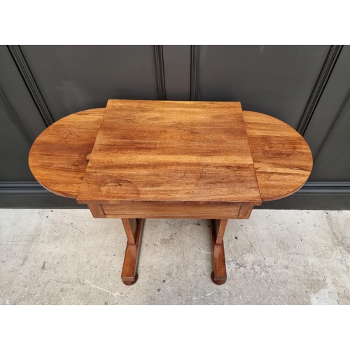 1069 - A Victorian walnut occasional table, with bow ends and frieze drawer, 91cm wide.  ... 