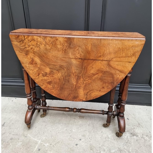 1072 - A Victorian figured walnut Sutherland table, 76cm wide.