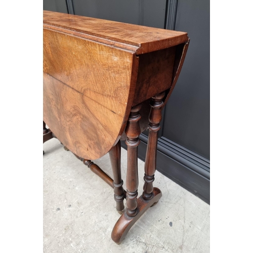 1072 - A Victorian figured walnut Sutherland table, 76cm wide.