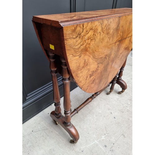 1072 - A Victorian figured walnut Sutherland table, 76cm wide.