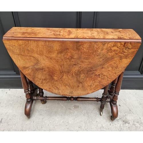 1072 - A Victorian figured walnut Sutherland table, 76cm wide.