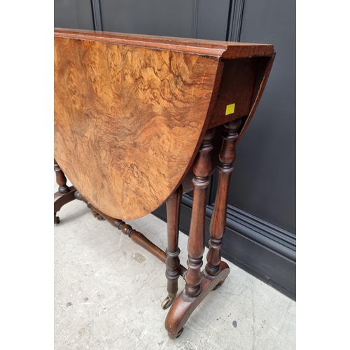 1072 - A Victorian figured walnut Sutherland table, 76cm wide.