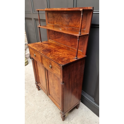 1073 - A George IV figured mahogany chiffonier, in the manner of Gillows, 82.5cm wide. ... 