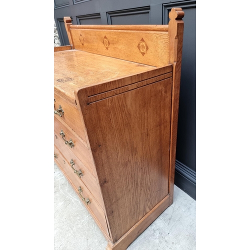 1074 - A good late Victorian, Gothic revival, oak and inlaid chest of drawers, in the manner of John Pollar... 