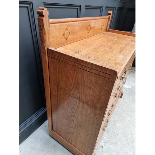 1074 - A good late Victorian, Gothic revival, oak and inlaid chest of drawers, in the manner of John Pollar... 