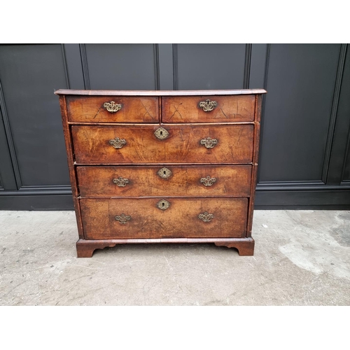 1079 - A George I walnut and crossbanded chest of drawers, 93.5cm wide. 