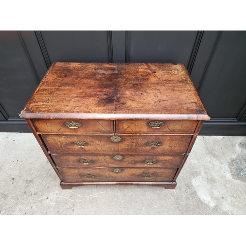 1079 - A George I walnut and crossbanded chest of drawers, 93.5cm wide. 