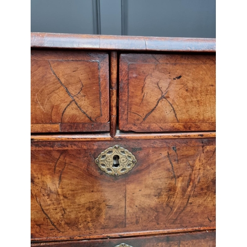 1079 - A George I walnut and crossbanded chest of drawers, 93.5cm wide. 