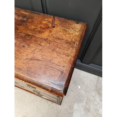 1079 - A George I walnut and crossbanded chest of drawers, 93.5cm wide. 