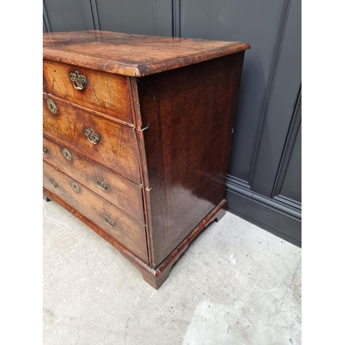 1079 - A George I walnut and crossbanded chest of drawers, 93.5cm wide. 