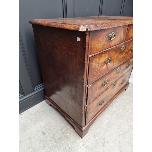 1079 - A George I walnut and crossbanded chest of drawers, 93.5cm wide. 