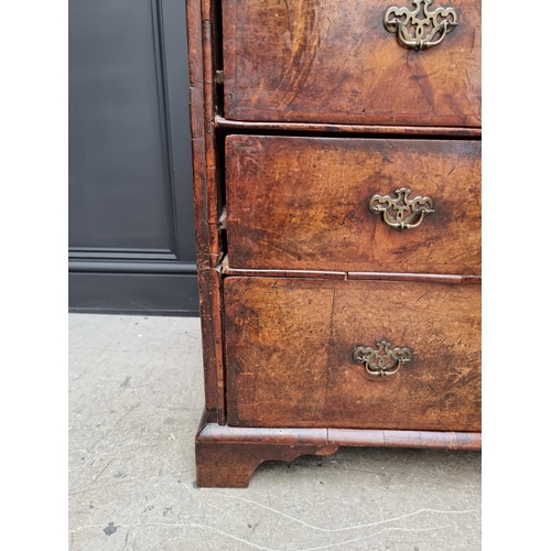 1079 - A George I walnut and crossbanded chest of drawers, 93.5cm wide. 