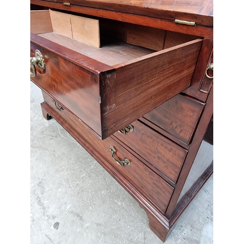 1083 - A George III mahogany bureau, the interior with inlaid drawers, 112cm wide. 